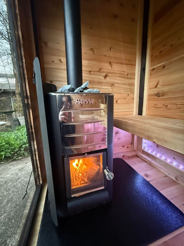 Harvia wood fired heater in a Uforia Sauna