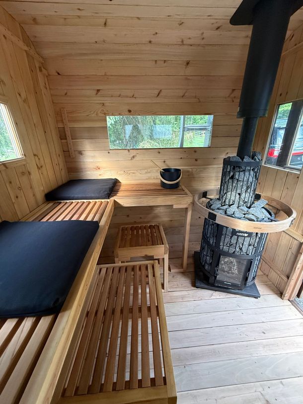 Wood fired outdoor Black sauna with rectangular windows