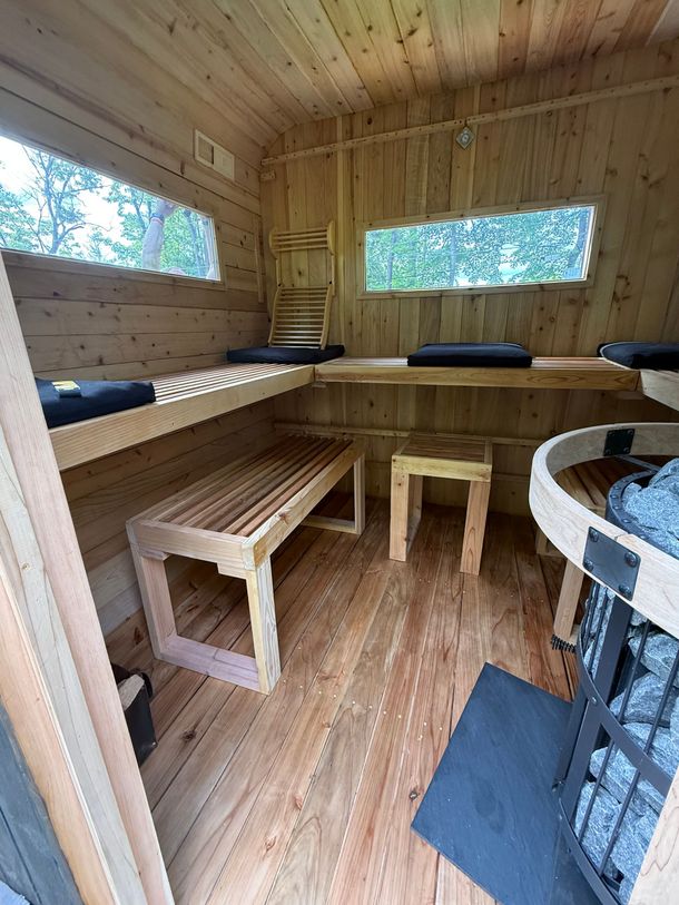 outdoor custom Uforia musket windows in a cube sauna