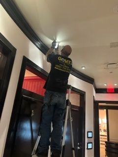 Man Stading on the Ladder While Working - Los Angeles, CA - Gomez Electric Inc