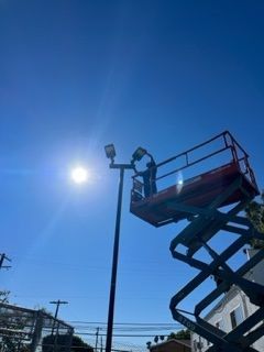 Man Working and Standing in Lift - Los Angeles, CA - Gomez Electric Inc
