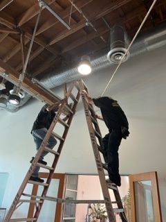 Man Standing on the Ladder - Los Angeles, CA - Gomez Electric Inc