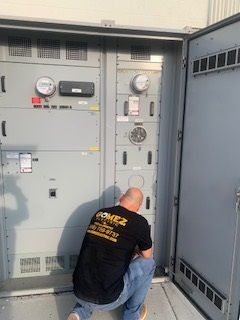 Man Working on the Machine - Los Angeles, CA - Gomez Electric Inc