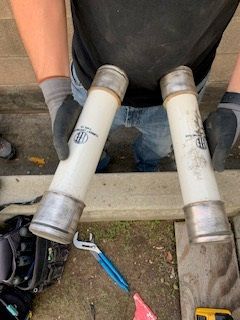 Someone Holding a Pipes - Los Angeles, CA - Gomez Electric Inc