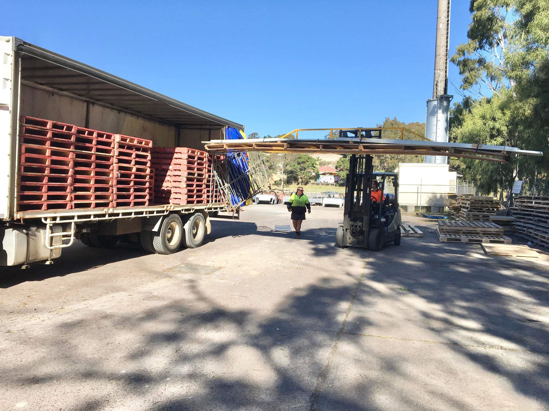 Forklift Near Truck — Professional Transport in Taree South NSW