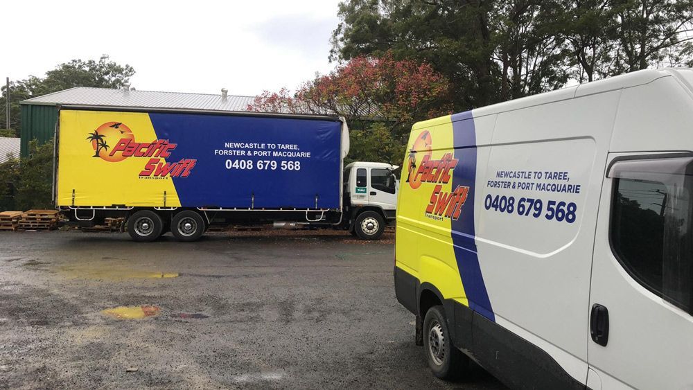 Trucks With Company Logo — Professional Transport in Taree South NSW
