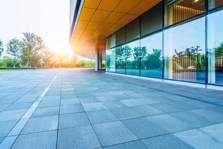 Modern office building exterior with pristine windows after expert business glass maintenance service.