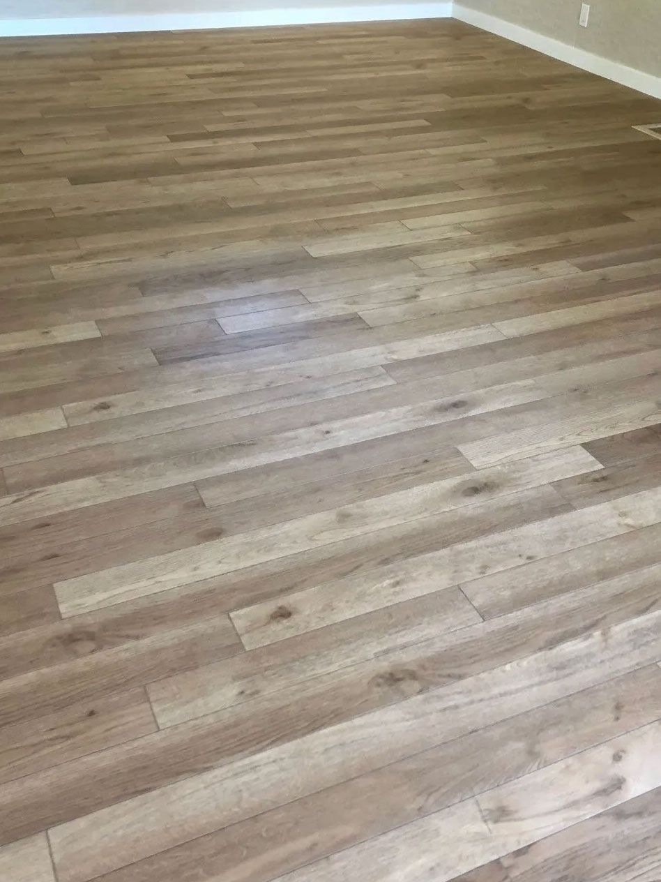 Wood-look flooring in a room with neutral walls, creating a clean, modern aesthetic.