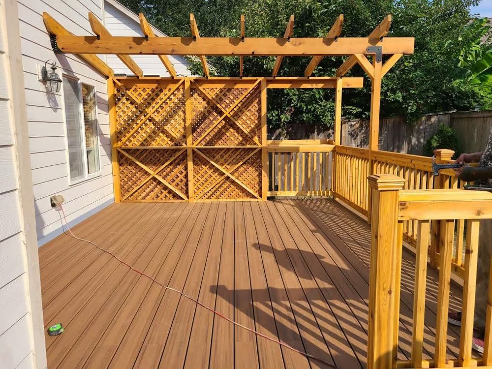 A wooden deck with a pergola on top of it.