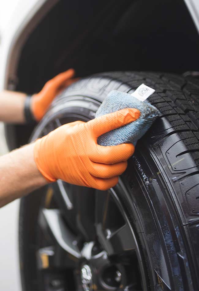 Tire shine being applied to corvette tires