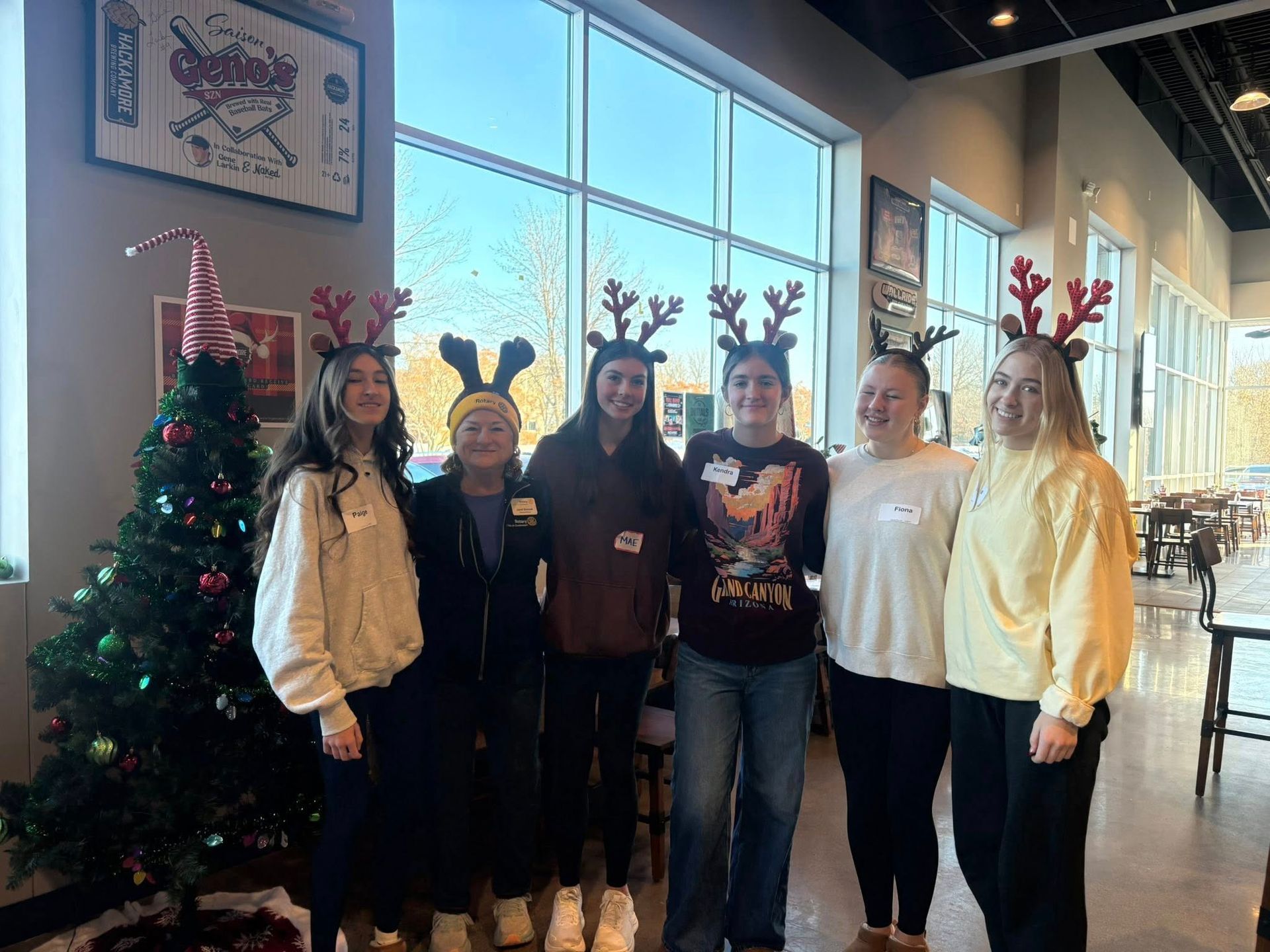 volunteers by the Christmas tree