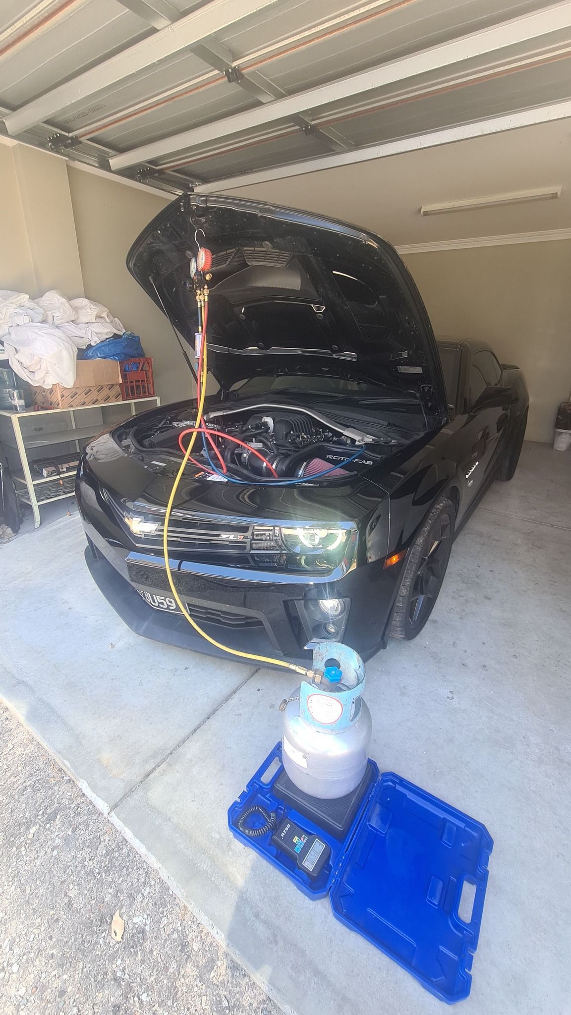 A man is working on a piece of luggage.