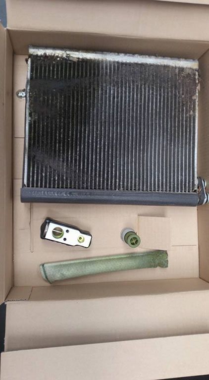 A close up of a radiator in a cardboard box.