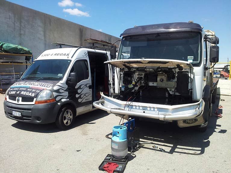 An aerial view of a cooling tower on the roof of a building.