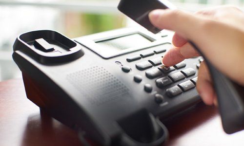 Client Dialing on the Phone — Arlington, TX — Omega Ob-Gyn Associates