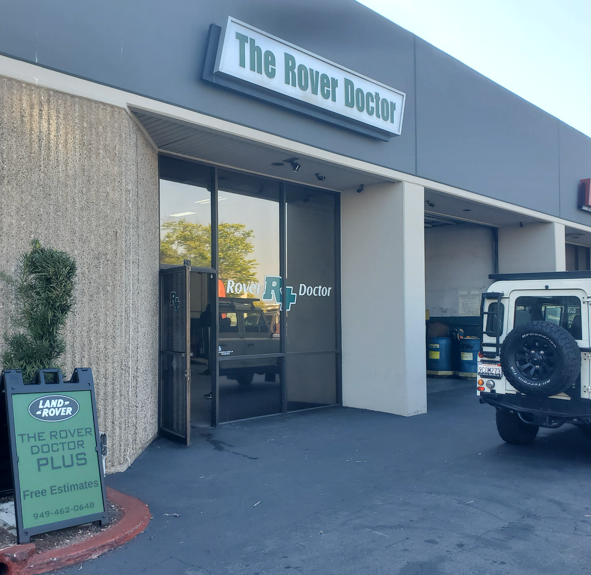 A building with a sign that says ' thompson & body ' on it