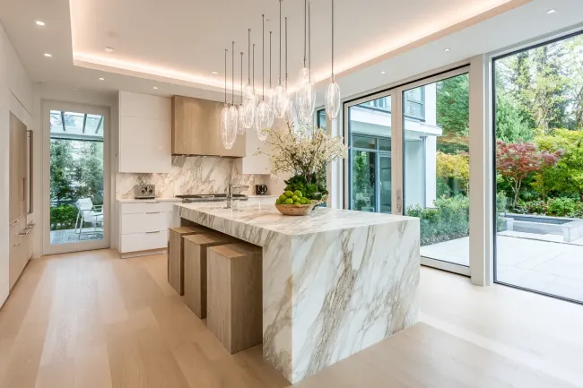 Custom kitchen design Burnaby BC including hand-built cabinetry, matte-finish hardware, and feature lighting. Experienced builders enhance workflow and storage efficiency.