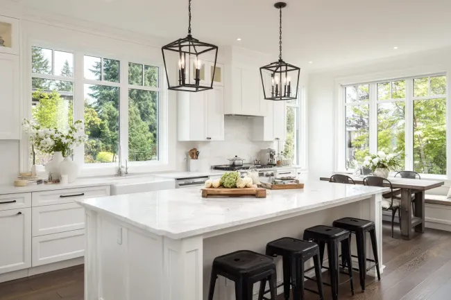 Contemporary kitchen renovation Burnaby British Columbia using Caesarstone surfaces, soft-close drawers, and modern appliance installations. Contractors ensure code compliance and elegant finishes across all Burnaby neighbourhoods.