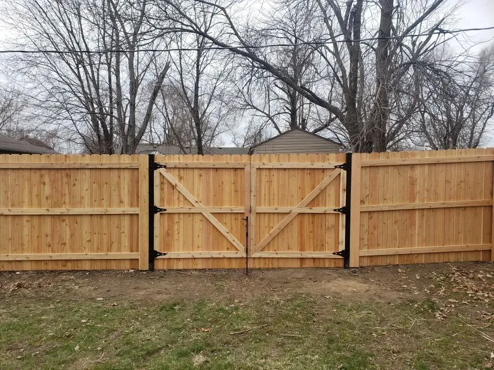 Wooden Fence and Gate — Marshalltown, IA — Fencing Solutions