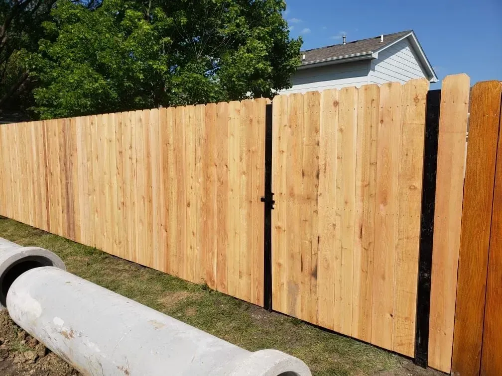 Wood Fences and Trees — Marshalltown, IA — Fencing Solutions