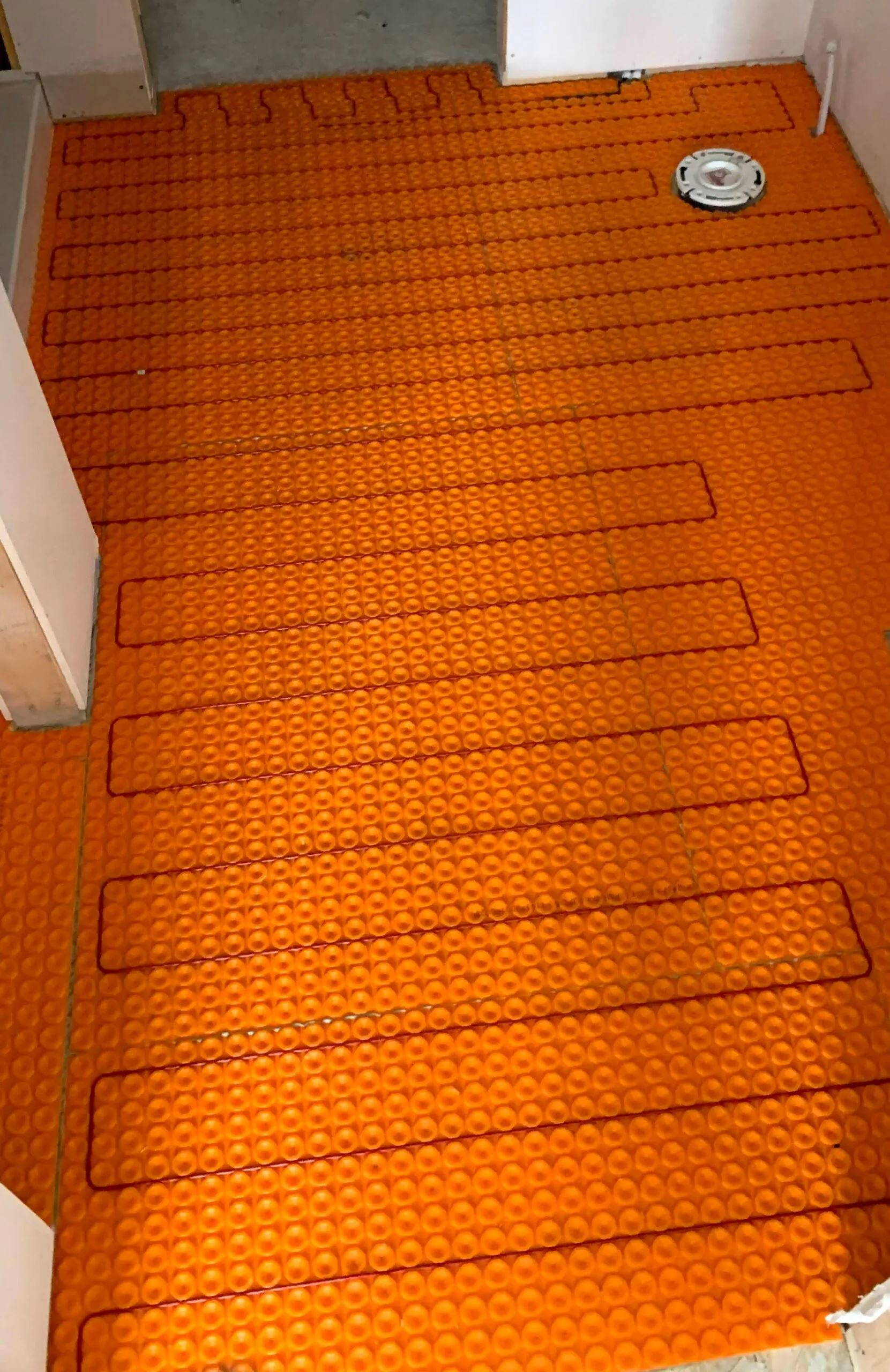 A Close Up Of An Orange Tile Floor — Rochester, MN — POWER PLUS ELECTRIC LLC