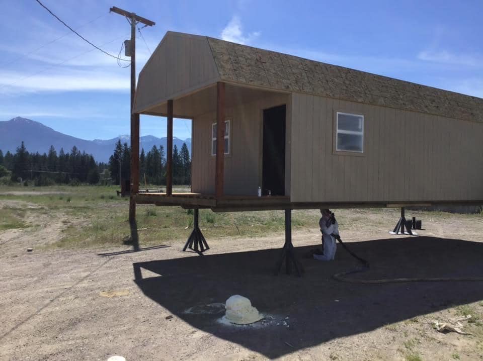 Man Spraying Insulation Under A Shed — Buhl, ID — Magic Valley Insulation LLC
