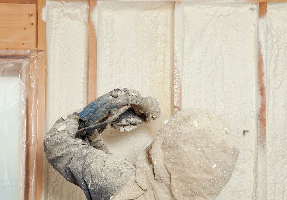 Man Spraying Insulation Foam — Buhl, ID — Magic Valley Insulation LLC