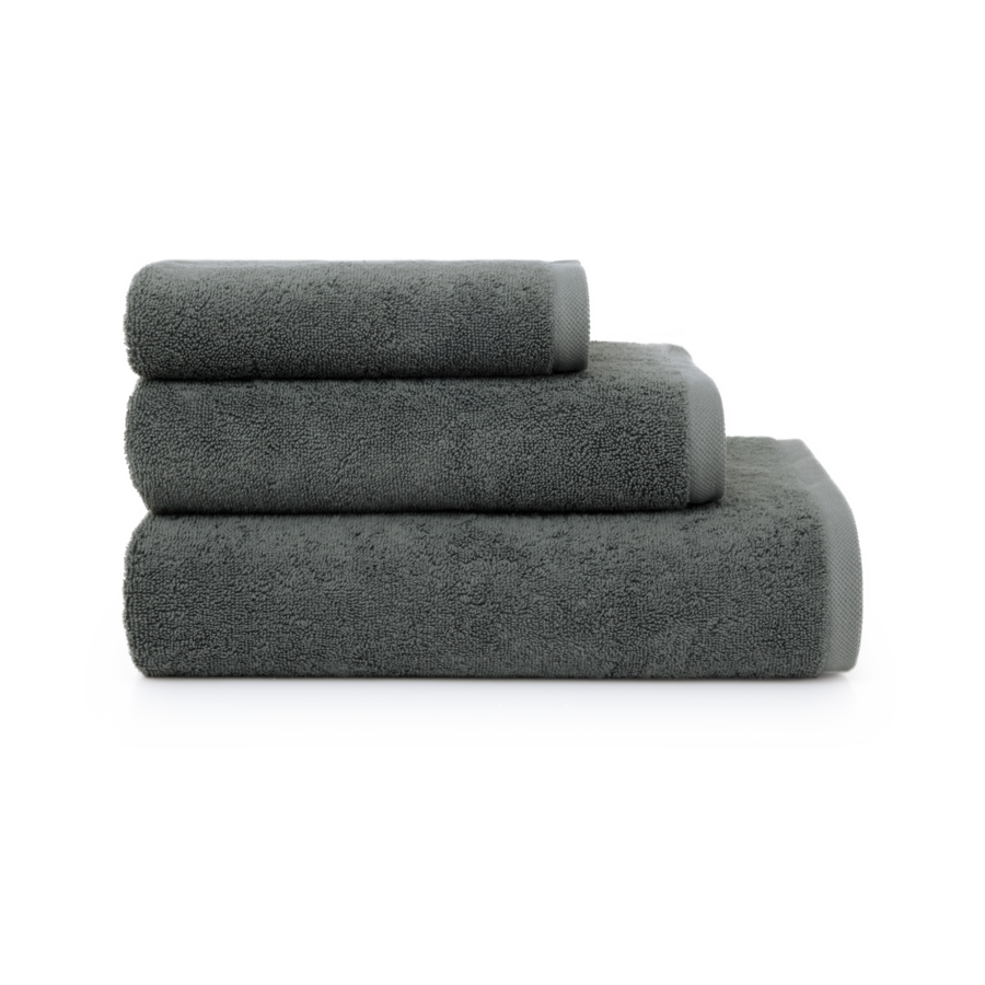 Three gray rolled towels stacked.