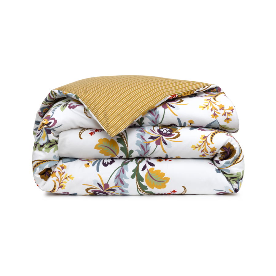 Couette pliée ornée d'un motif floral blanc avec des accents jaunes et violets, réversible avec un côté texturé jaune moutarde.