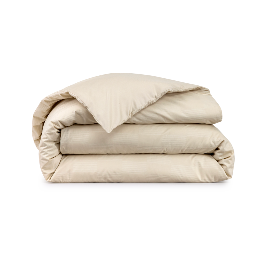 Folded beige duvet.