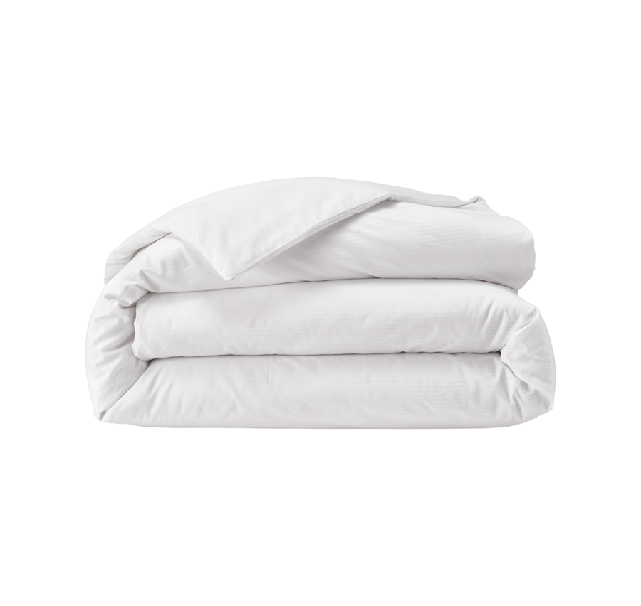 Couette blanche pliée.