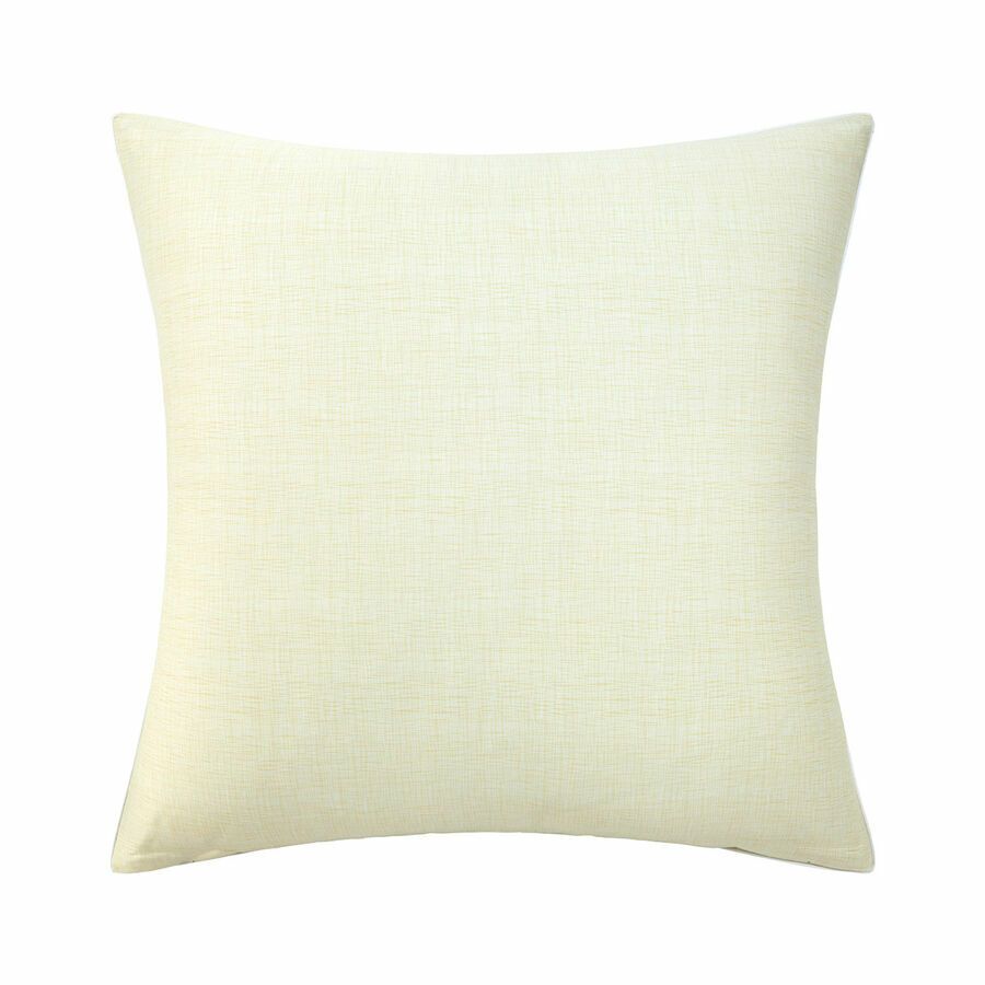 Un coussin carré blanc sur fond blanc
