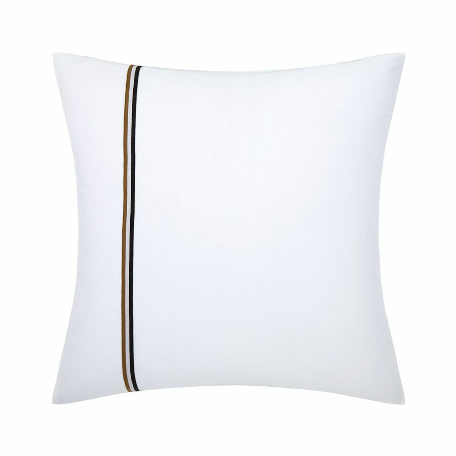 Un oreiller blanc avec une rayure noire et marron dessus