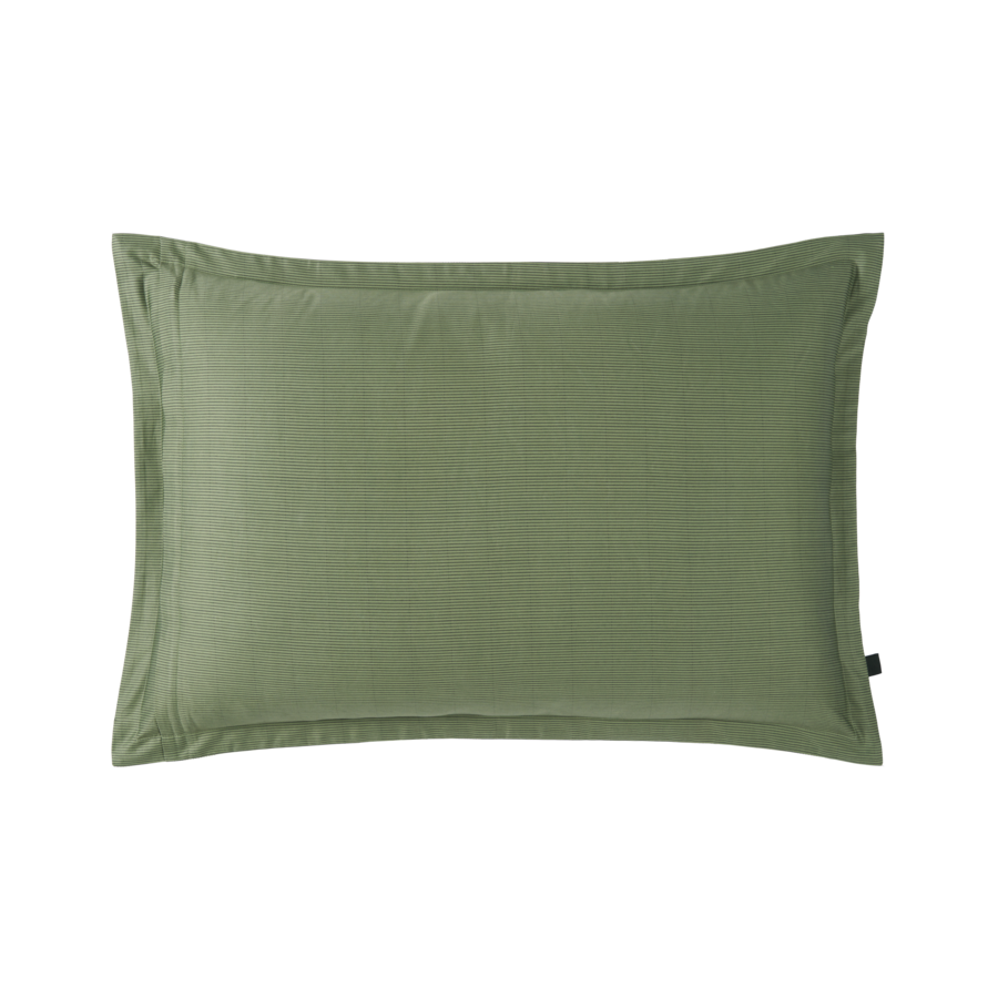 Un oreiller vert avec une bordure noire sur fond blanc.