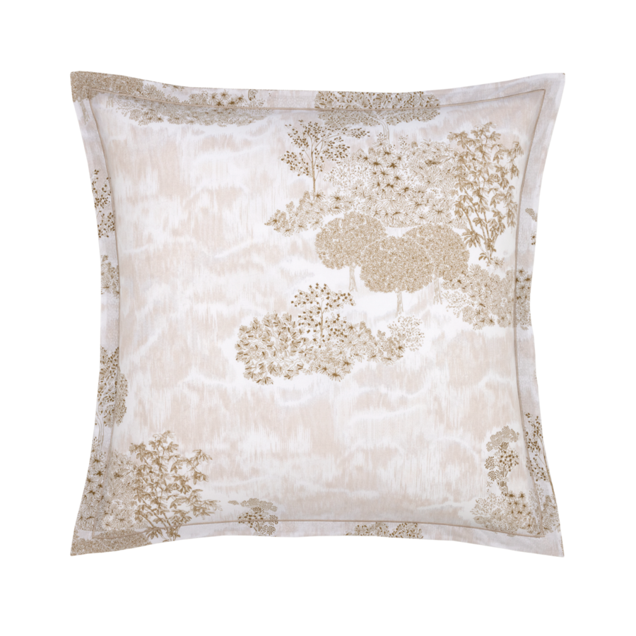 Coussin carré beige et crème à motif d'arbre.