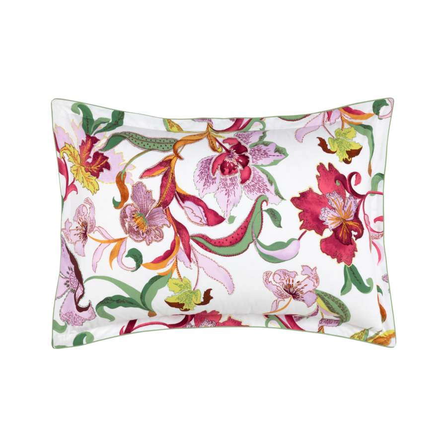 Un oreiller blanc avec un motif floral dessus