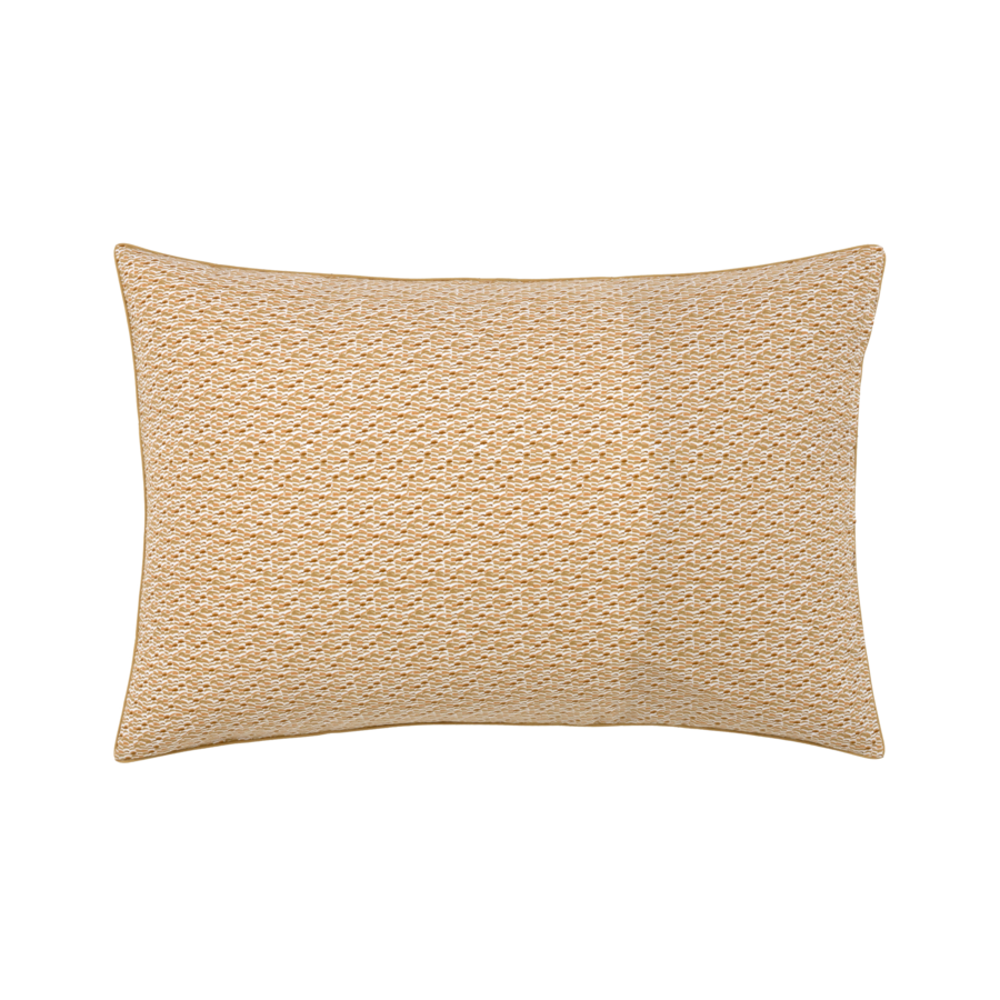 Un oreiller beige avec un motif dessus