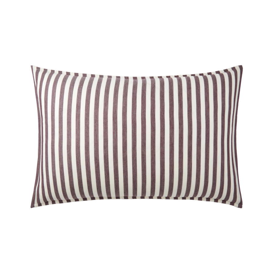 Coussin rayé à rayures verticales brunes et blanches.