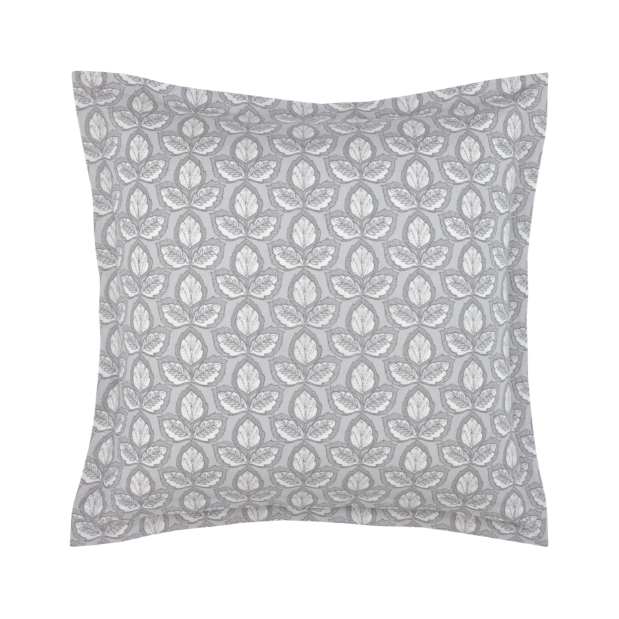 Coussin décoratif à motifs gris et blancs avec un motif de feuilles.
