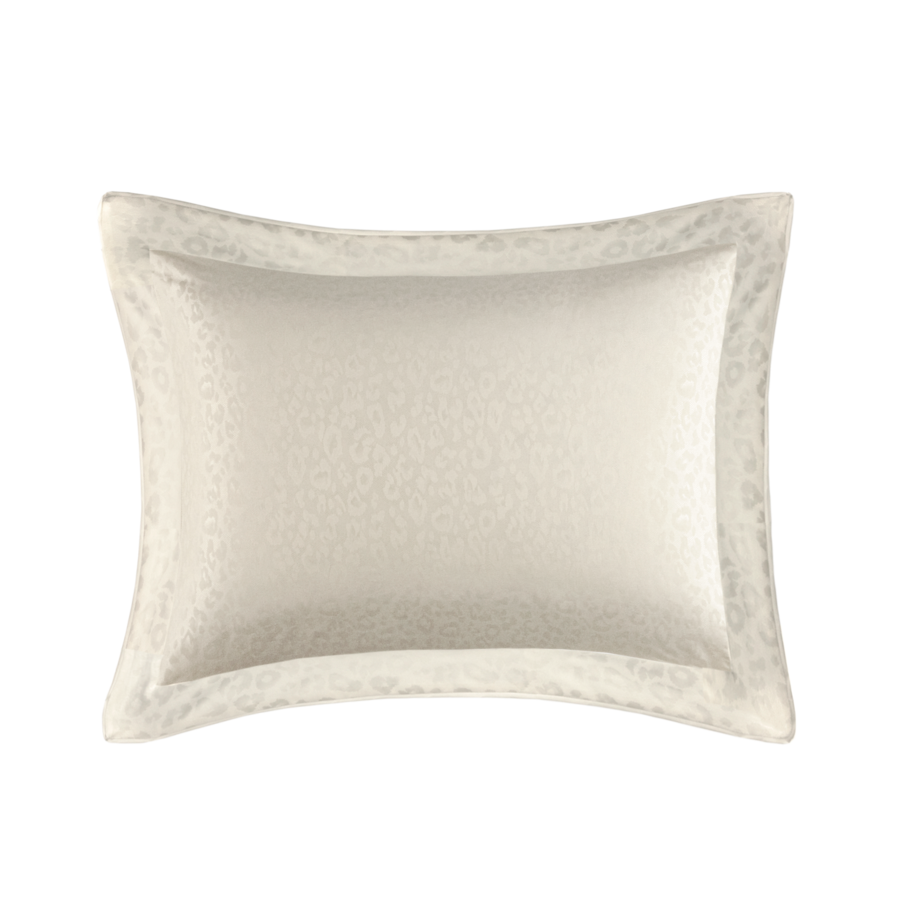 Coussin rectangulaire couleur crème avec un centre texturé et une bordure à motifs.