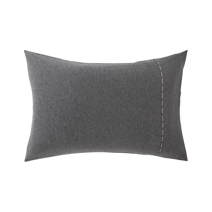 Un oreiller gris avec une couture blanche sur le côté