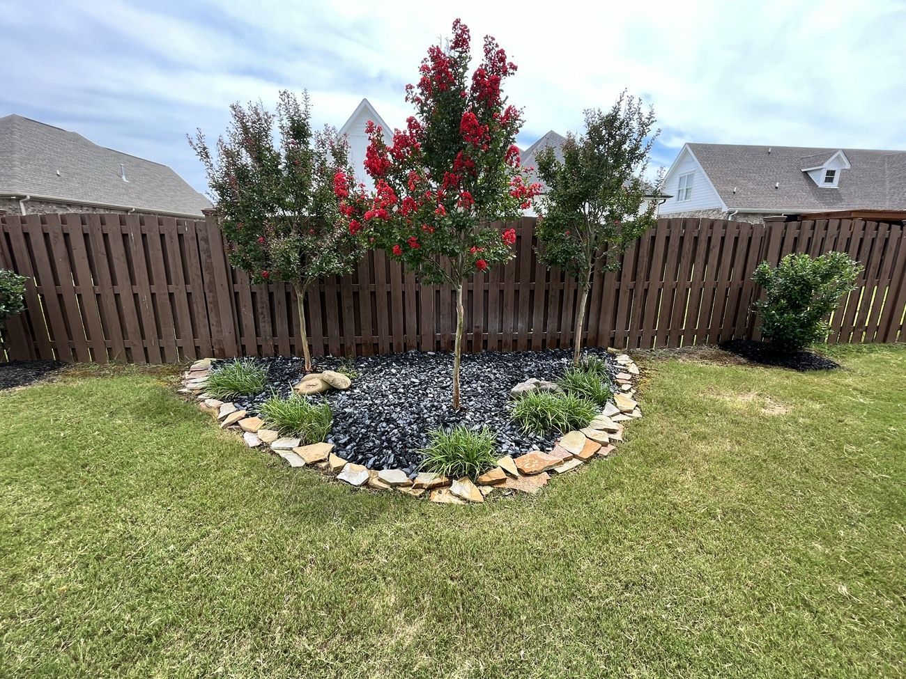 There is a heart shaped garden in the middle of the yard.