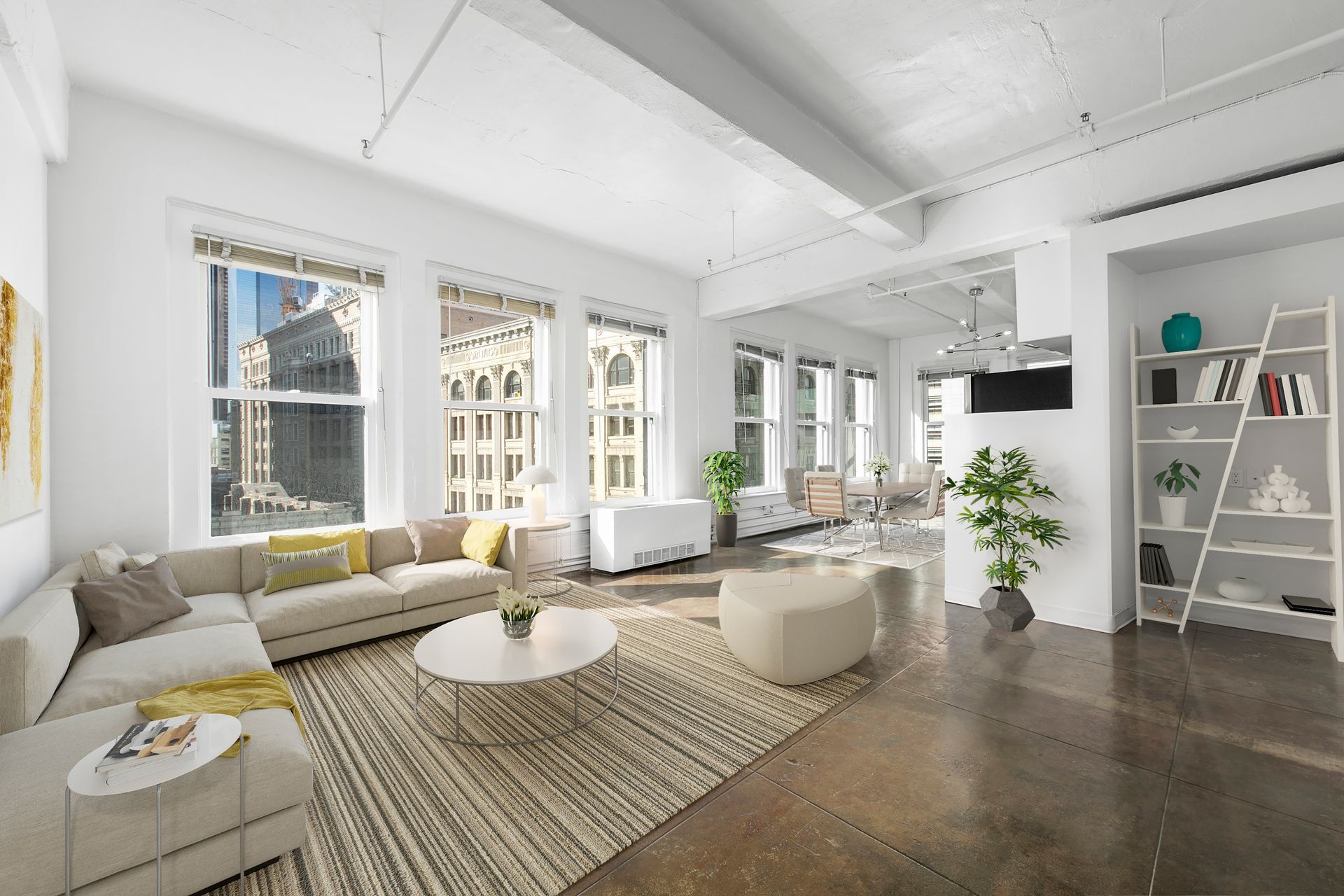 Bright modern living room with white walls, large windows, light sofa, rug, coffee table, and shelving unit