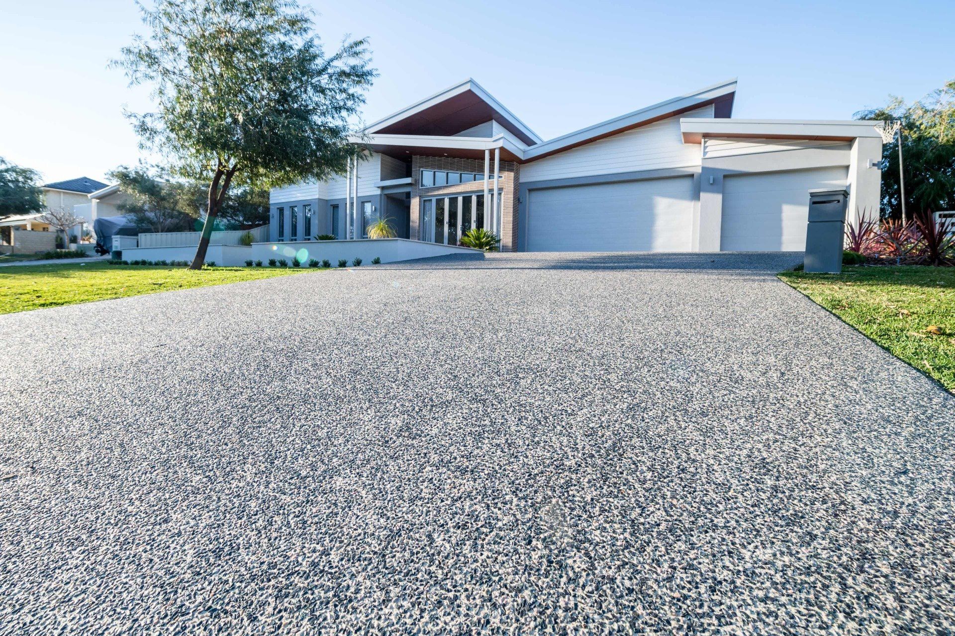 exposed aggregate driveway installed in a modern home in Coral Springs FL