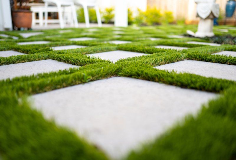 concrete slab pavers with artificial turf in between