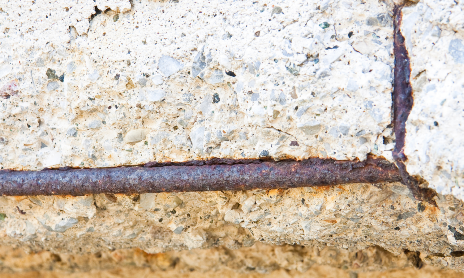 rusting rebar which has spalled in a beam. preparing to be restored by a concrete contractor in fort lauderdale
