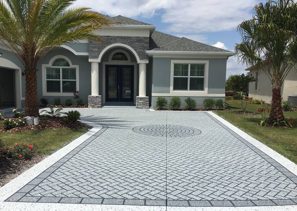 Lauderdale Concrete contractors installed this decorative stamped concrete in a Fort Lauderdale driveway