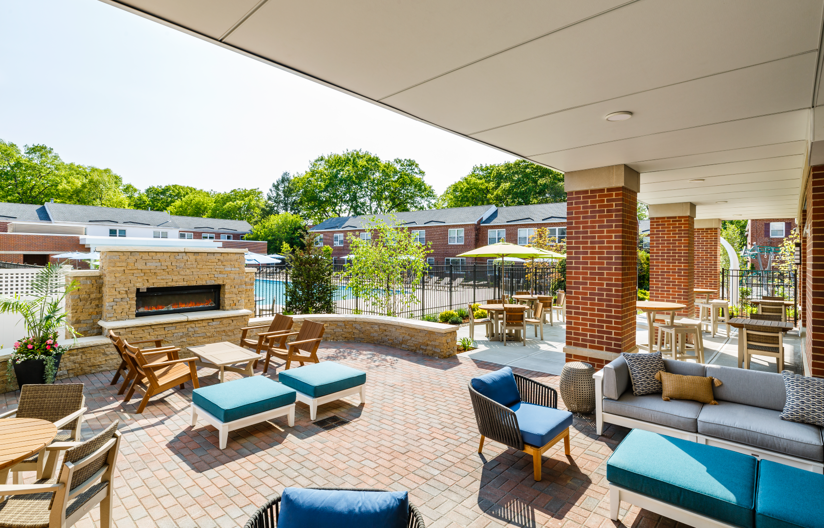 There is a fireplace in the middle of the patio.
