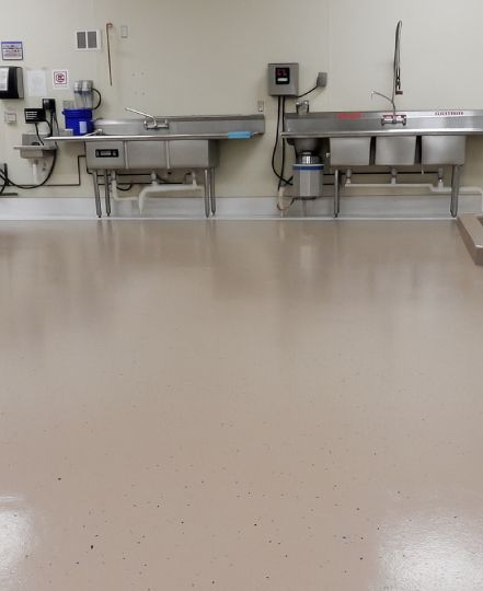 epoxy coated floor in a clean commercial kitchen area