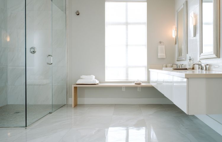 freshly installed light gray epoxy floor in a residential bathroom